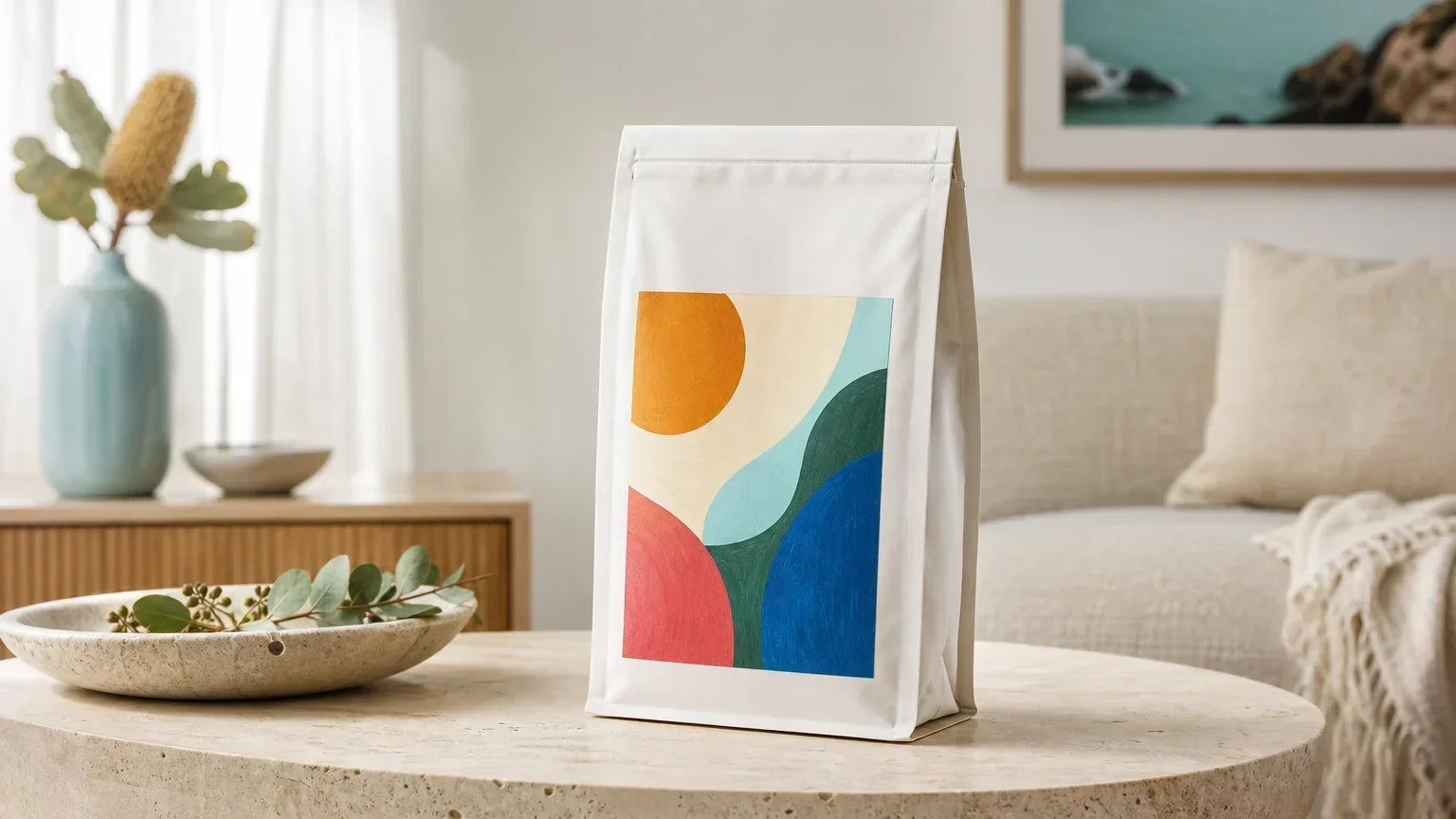 A colourful-label specialty coffee bag shown alone in a bright living room.