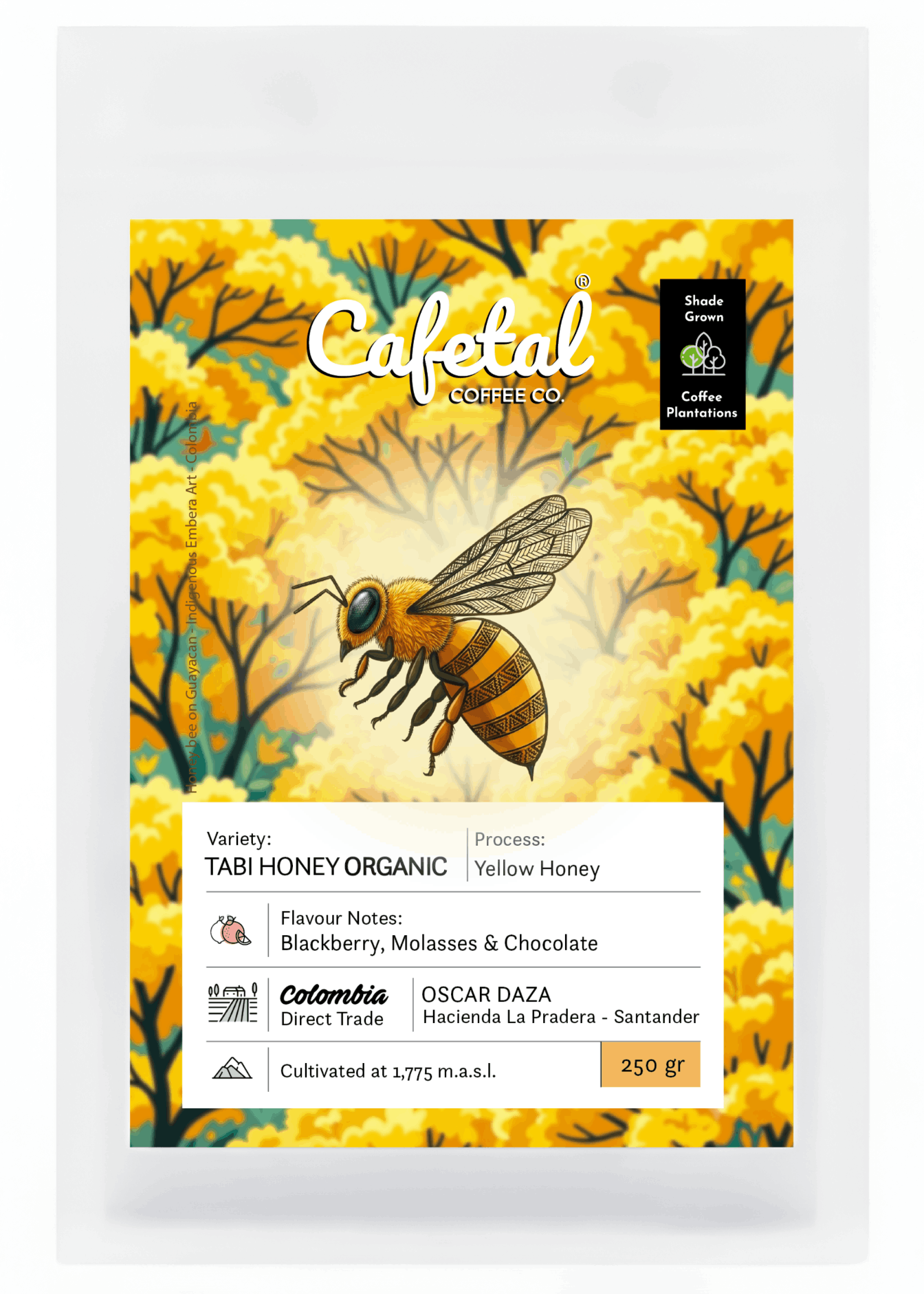 A package of Cafetal Coffee Co. Tabi Honey Organic coffee, featuring a vibrant yellow and orange floral background with an illustration of a honeybee.